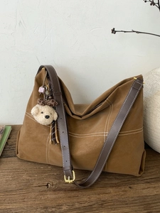 Vintage camel frosted tote bag with contrast stitching and plush bear charm decoration