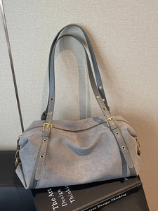 Minimalist grey matte suede Boston shoulder bag with adjustable gold hardware buckles