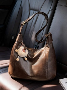 Classic dark brown soft leather hobo tote bag with a cute plush sheep pendant