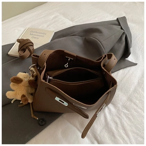 Brown lychee leather bucket handbag with inner pouch and cute puppy plush charm