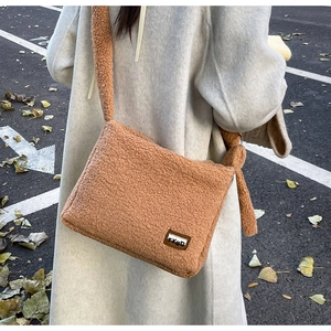Detailed back view of a fuzzy brown faux fur crossbody bag for autumn winter fashion