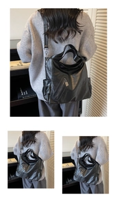 Close-up of black matte PU leather tote bag showing side pockets and metal zipper detail