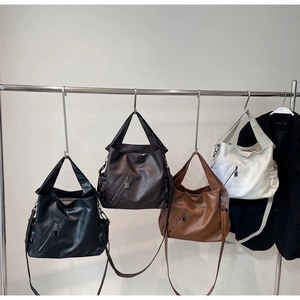 Showcase of classic leather tote bags in black, brown, camel, and white color options