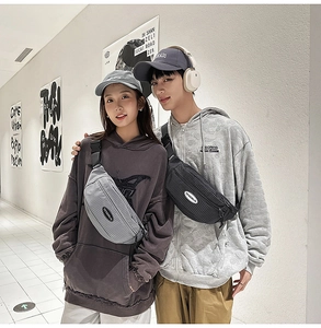 Modern plaid texture crossbody bag shown on models in light gray and dark gray colors