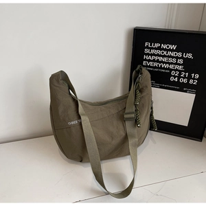Detailed macro view of military green canvas fabric texture and white lettering on bag