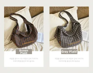 Detailed comparison of brown and gray plaid canvas tote bags in a cozy bedroom setting