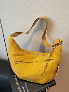 Minimalist yellow canvas crescent crossbody bag for women with Three Trees logo and large capacity