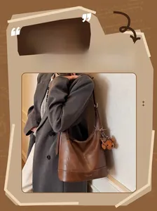 Coffee brown retro leather tote bag with a cute teddy bear charm and fashion text