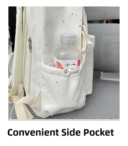 Detail view of the functional side pocket with a drawstring cord on a floral backpack