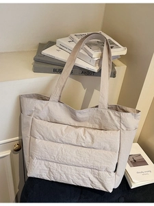 Quilted beige nylon tote bag with spacious design for casual commuting and daily use
