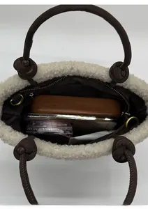 Internal view of the beige fleece bucket bag showing large capacity for essentials
