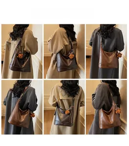 Large vintage brown leather tote bag with cute bear pendant shown from multiple angles