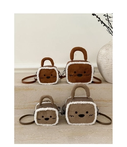 Detail showing plush square bags in brown and khaki with cute embroidered animal faces