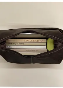 Detailed top view of a large brown leather hobo bag showing spacious interior capacity
