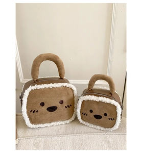 Detail of plush suede square handbags with lamb wool trim and cute animal embroidery
