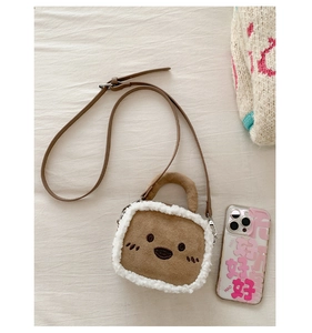 Plush teddy bear mini crossbody bag with phone size comparison for capacity detail
