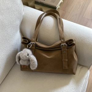 Brown faux leather hobo bag with adjustable silver buckle and cute plush rabbit charm