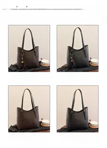 Detail view of vintage PU leather bucket bags in brown and black with triangle logo