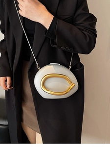 Chic white acrylic pebble-shaped crossbody bag with gold ring and fine chain strap