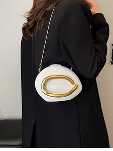 Minimalist white pebble-shaped acrylic crossbody bag with elegant gold chain and C-shaped clasp