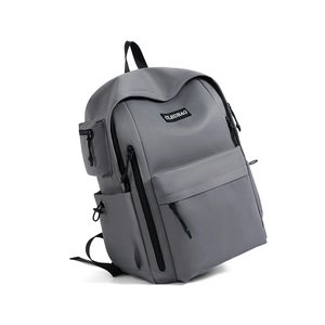 Detail of grey commute backpack with multi-pocket design and water-resistant fabric