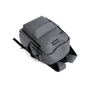 Detail view of water-resistant gray travel backpack with functional zipper pockets