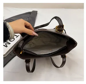 Top view showing the spacious interior with a zip pocket in a dark brown bucket bag
