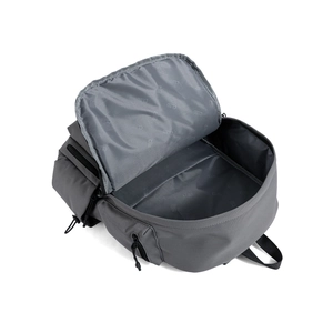 Detail view of large gray travel backpack with spacious printed lining and zip pockets