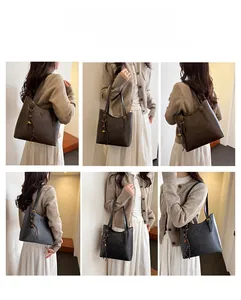Detailed views of vintage leather bucket bag in black and brown with adjustable strap
