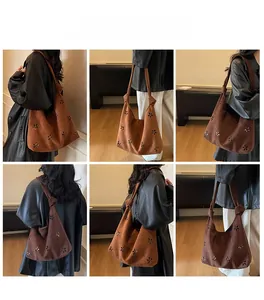 Brown suede tote bag with laser-cut floral patterns and knotted shoulder strap style