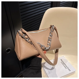 Detail of khaki textured leather shoulder bag with thick silver chain and long strap