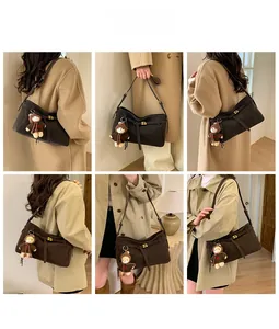 Deep brown tote bag with bear charm shown in multiple angles on camel coat