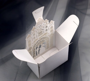 Laser cut white European wedding candy box with castle design and pearlescent paper finish