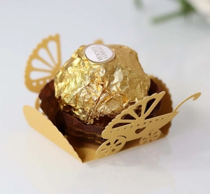 Laser-cut baby stroller chocolate holder for baby shower party favors in gold and brown