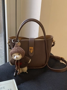 Vintage dark brown pebble leather bucket bag with gold buckle and cute bear pendant charm