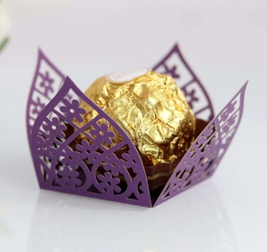 Close-up of laser-cut purple flower lace chocolate wrapper with elegant hollow design