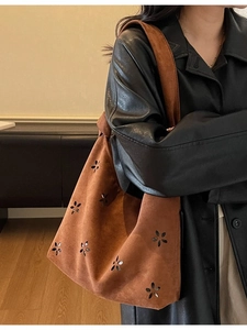 Caramel brown suede tote bag with floral cutout design and comfortable wide shoulder strap