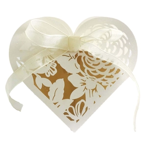 Elegant laser-cut heart gift box with white rose hollow pattern and golden ribbon