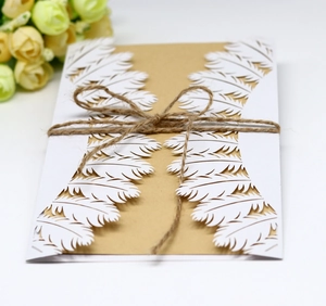 Laser cut feather design wedding invitation with kraft paper card and twine bow