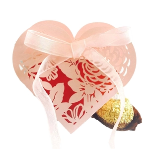 Pink heart-shaped hollow laser cut wedding candy box with rose pattern and ribbon