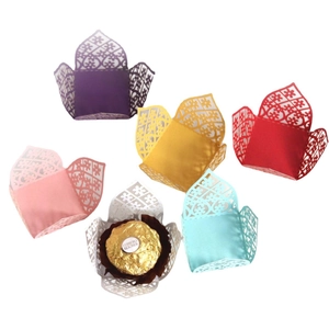 Laser cut hollow paper favor boxes in multiple colors for wedding and party candy decor