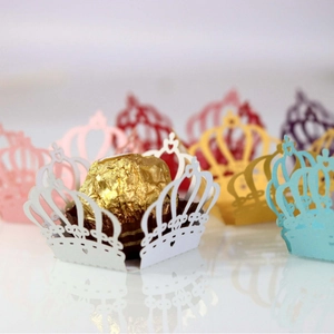 Laser-cut crown cupcake wrappers in various colors for chocolate and party decorations