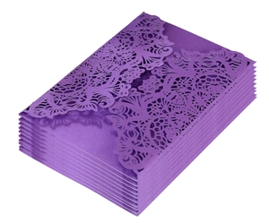 Deep purple laser cut invitation sleeves with intricate vintage floral patterns