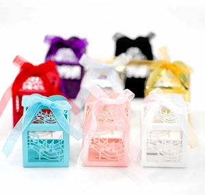Laser cut music note candy boxes with organza ribbons in various vibrant colors