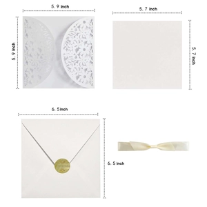 White laser cut floral wedding invitation set with ribbon and envelopes for guests