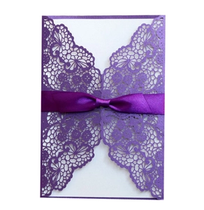 Elegant purple laser cut butterfly wedding invitation with a satin ribbon bow detail