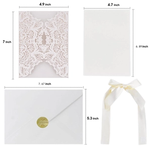Laser-cut white floral hollow wedding invitation set with ribbon and envelope