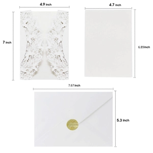 White laser cut wedding invitation set with butterfly patterns, inner card, and envelope