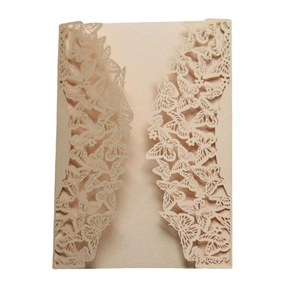 Detailed laser-cut butterfly hollow pattern on champagne invitation card for elegant weddings