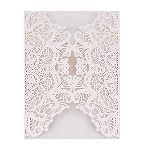 Elegant white laser-cut wedding invitation with intricate lace floral hollow design